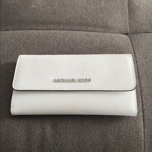 White Micheal Kors trifold wallet.